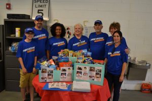 Volunteers Wearing Progressive Insurance T-Shirts